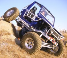 a person riding a blue off road vehicle